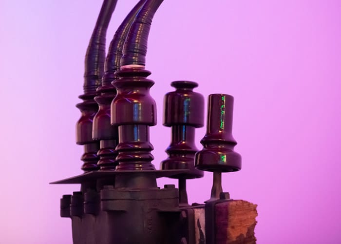 Disconnecting porcelain pot head on a purple background.