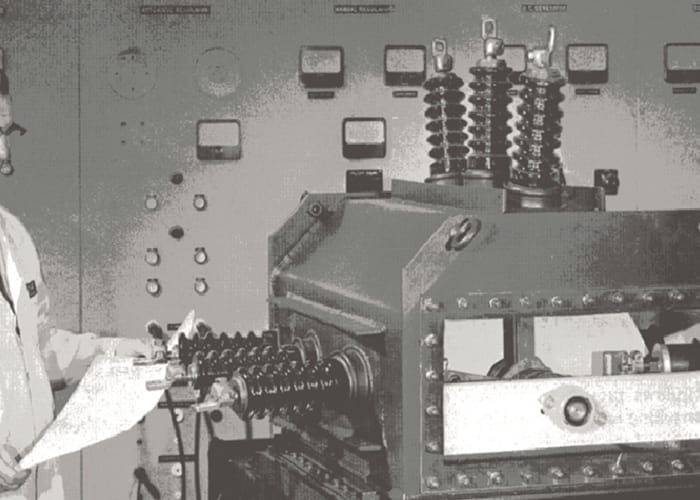 A man looking at a large machine