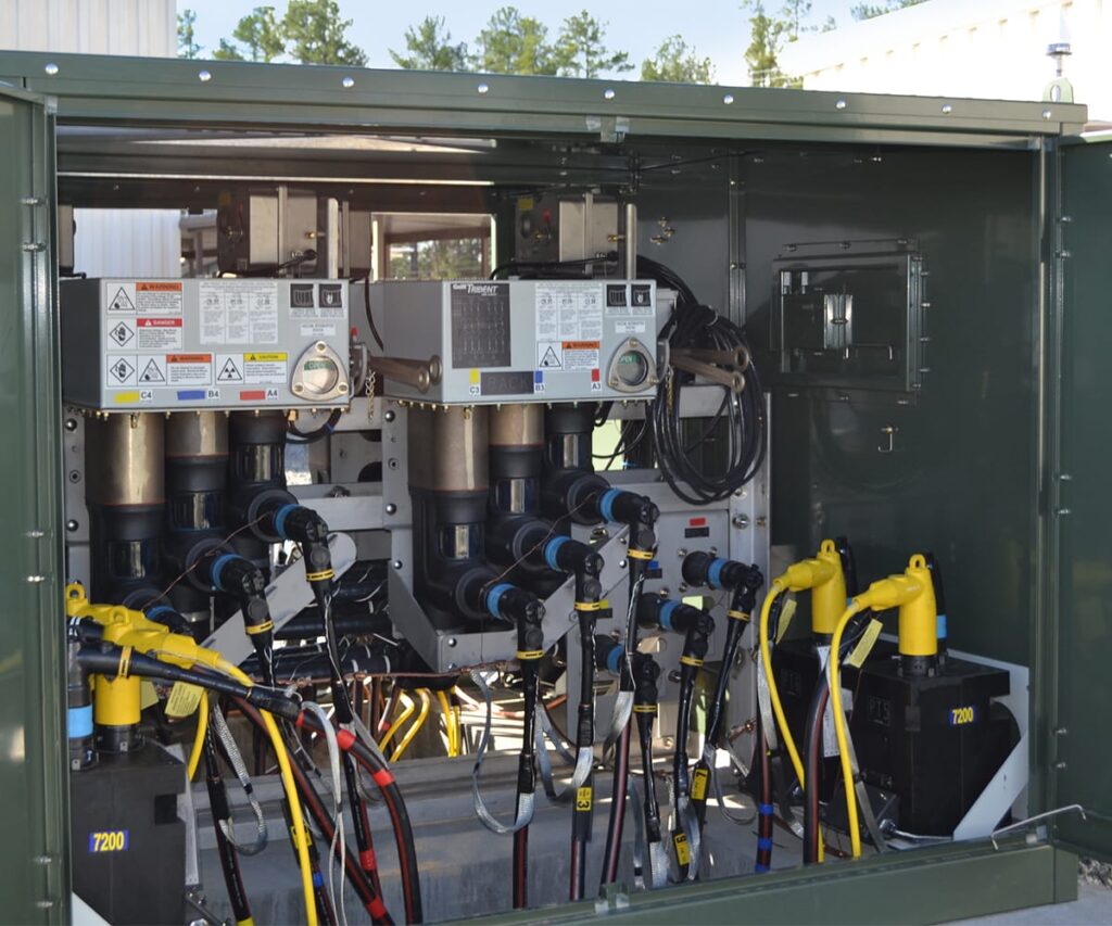 Trident Solid Dielectric switch in a green cabinet